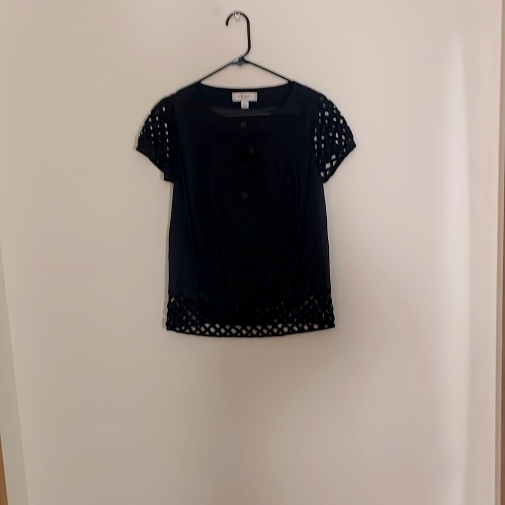 Navy blue button-up blouse, linen and lattice design at sleeve and waist.